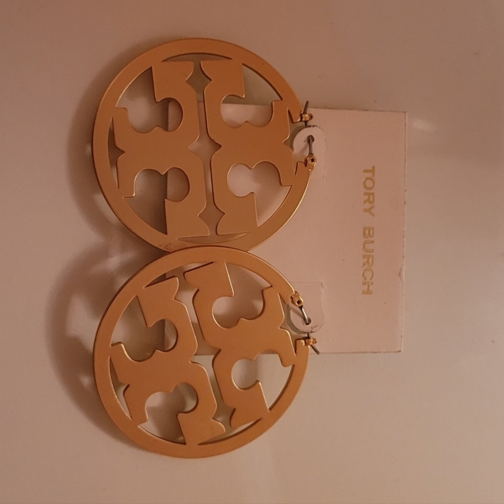 Tory Burch gold hoop earrings.